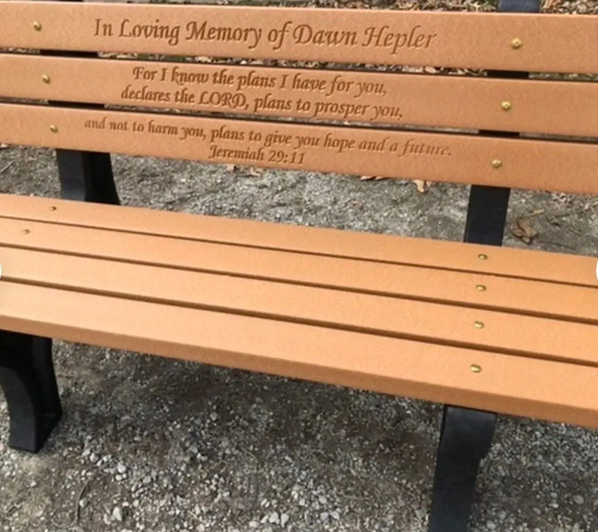 A bench with the words in memory of queen elizabeth.